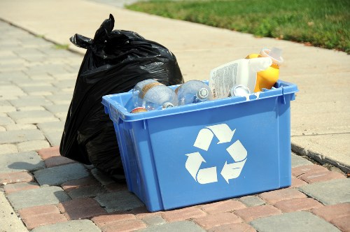 Various types of waste being loaded into a grab hire container